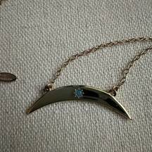 Kris Nations Silver crescent moon pendant w blue crystal star in center.  NWOT