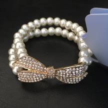 Elegant Stretch Pearl Gold Bow Pave Crystal Brace