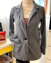 Blazer/jacket. Single button closure with pockets. Casual.