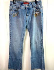 Guess Vintage women’s size 30 authentic boot cut jeans with embellishments.