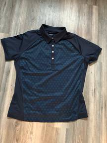 Nike Golf size medium polo style shirt, pit to pit is 20, length is 23