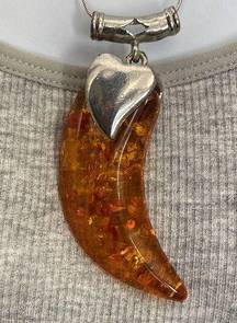 18K GP amber tooth shaped pendent with new stainless chain.