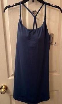 sports dress with built in padded bra and spandex with pockets.