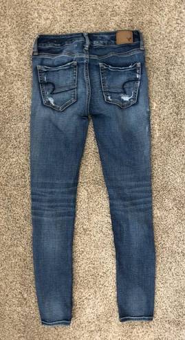 American Eagle Outfitters Ripped skinny jeans w patches Blue Size 0