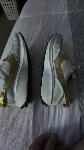 Nike white and gold  debuts