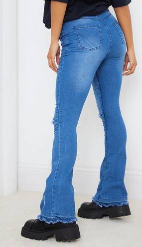 Pretty Little Thing Mid Blue Distressed Knee Flare Jean