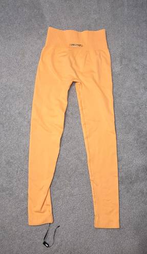 Bo and Tee NWOT  Orange Leggings Size Small