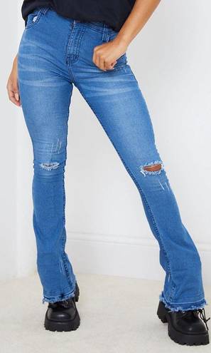 Pretty Little Thing Mid Blue Distressed Knee Flare Jean