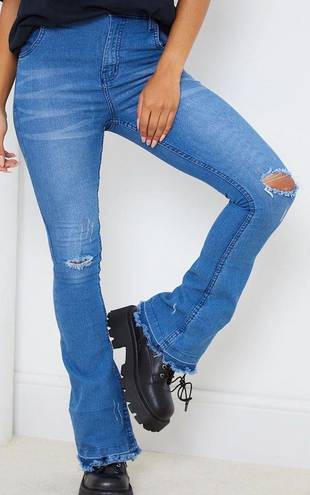 Pretty Little Thing Mid Blue Distressed Knee Flare Jean