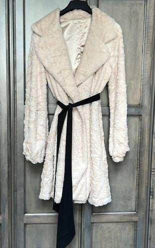 Hazel trench style coat. Cream furry material with black silky ribbon belt. Size L