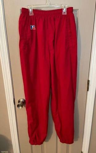 Russell Athletic Russell women’s vintage red lined nylon track pants w/pocket zip ankles. Size L