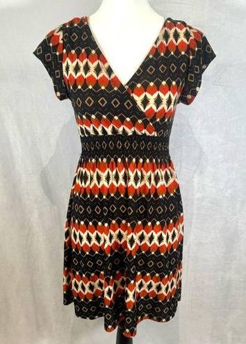 Cristina Love black and burnt orange abstract print smocked dress size medium