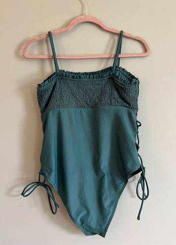 One Piece Green Swim Suit With Side Cut Outs