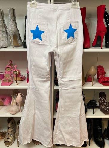 Vibrant White bell bottom jeans with stars on pockets