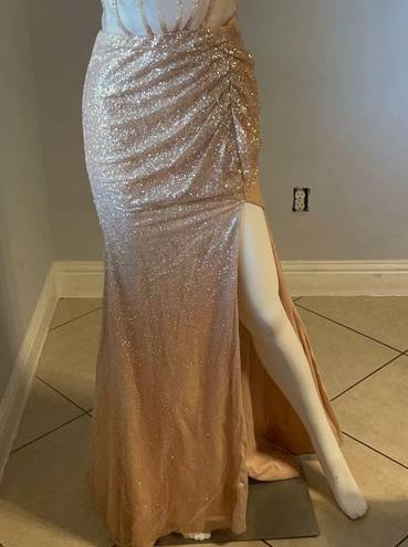 Cinderella Divine Women’s formal sparkly dress size 4
Brand is 
Rose gold color