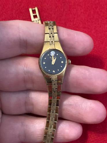 Bulova Woman’s gold plate stainless steel diamond dial  watch