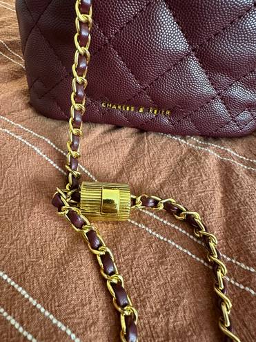 Charles and Keith  burgundy purse 