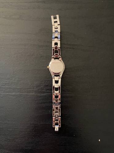 Relic BY FOSSIL-TWO TONE WATCH Beautiful gold and silver tone stainless steel watch with little diamond rhinestones, excellent condition, I have attached a video showing the watch works great.