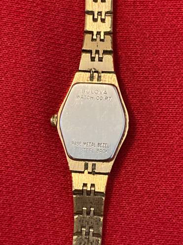 Bulova Woman’s gold plate stainless steel diamond dial  watch