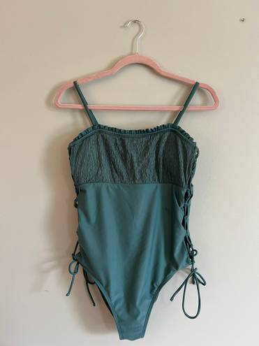 One Piece Green Swim Suit With Side Cut Outs