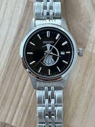 Seiko  Ladies Watch Black Dial with Train motif Stainless Bracelet and hands