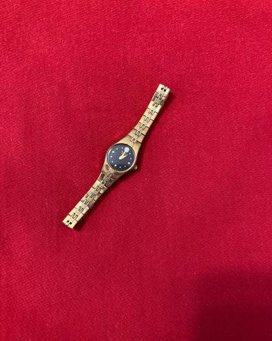 Bulova Woman’s gold plate stainless steel diamond dial  watch