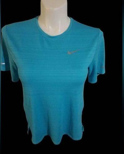 Nike  size small dry fit turquoise topbust 36 inches length 25 “short sleeve