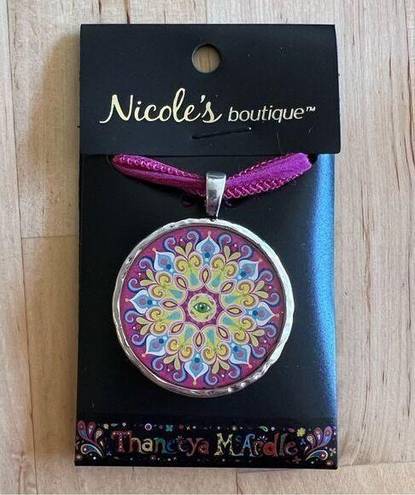 Necklace with sparkly mandala and evil eye design on pink ribbon