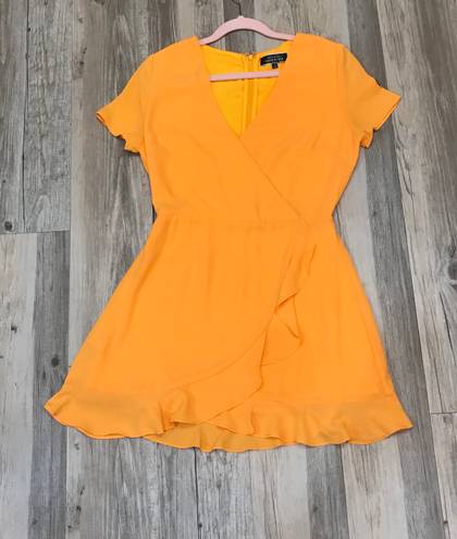 Blue Blush Boutique Blush Wild Tangerines Faux Front Wrap Mini Dress with Ruffled Hem size small. 