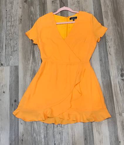 Blue Blush Boutique Blush Wild Tangerines Faux Front Wrap Mini Dress with Ruffled Hem size small. 