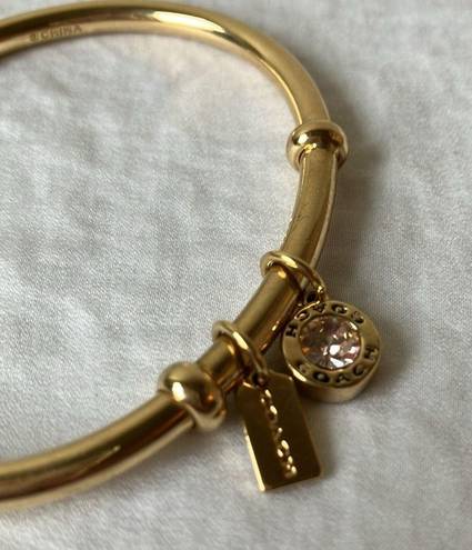 Coach: Gold Tone Charm Braclet- 2 charms- coach tag & rhinestone- open/slide on