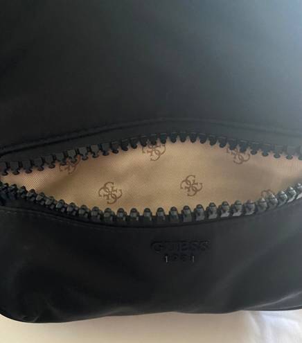 GUESS -BLACK BACKPACK  The perfect backpack, all black with black hardware, front zip pocket, inside has a zip pocket and 3 open pockets, excellent condition  Measures: 10x8 1/2 x 4 inches