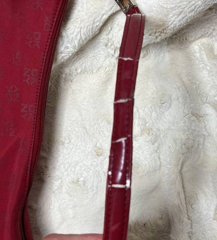 DKNY  red monogram purse. Shoulder bag. Some cracking on inside of strap