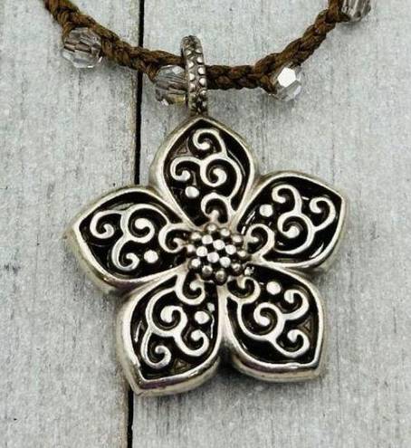 Brighton  Silver Toned Flower Reversible Pendant on a Brown Braided Cord. EUC!