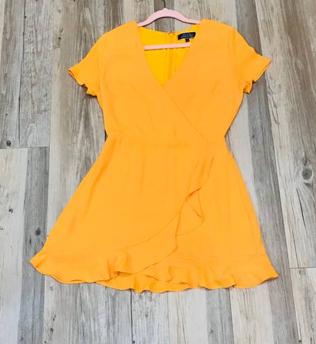 Blue Blush Boutique Blush Wild Tangerines Faux Front Wrap Mini Dress with Ruffled Hem size small. 