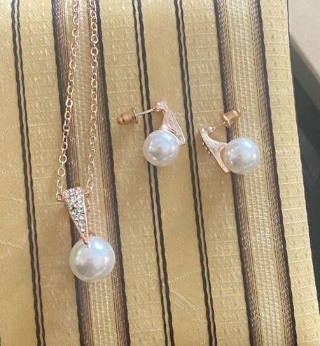 Matching Faux Pearl and Rhinestone Pendant Necklace and Earring Set.