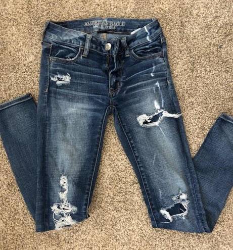 American Eagle Outfitters Ripped skinny jeans w patches Blue Size 0