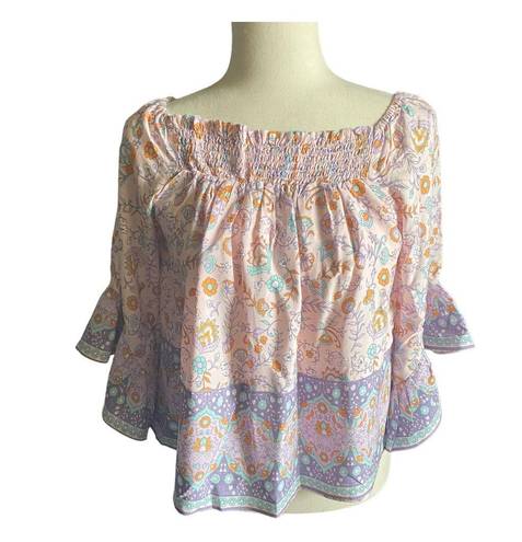 Petal and Pup NWT--GORGEOUS BOHO TOP-SIZE 2 Beautiful pinks and blues boho top, elastic neckline, can be worn in or off shoulder, ruffle sleeves, 100% rayon, new with tags, size 2 Measurements: Bust: armpit to armpit 17-19 inches  Length: shoulder seam to bottom 22 inches 