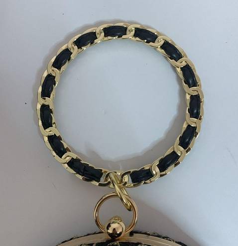 AWESOME GOLD AND BLACK ROUND PURSE WITH G&B WRISTELT HANDLE