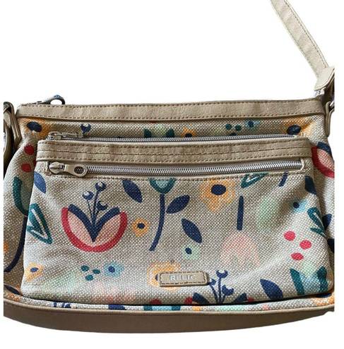 Relic super cute tan floral crossbody bag, top zip closure, two front zip pockets, inside zip pockets, inside card slots, adjust strap, excellent condition, measures 11x8 inches