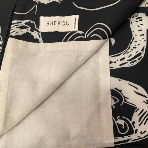 Shekou Black and White face skirt. Size Medium and from .