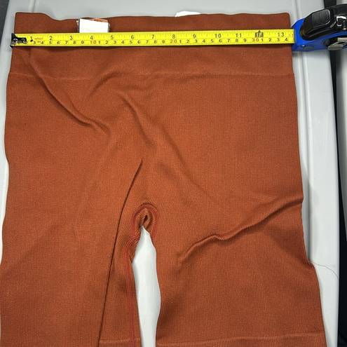 Gilly Hicks #7  size large burnt orange spandex b8