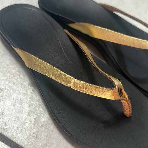 Olukai  Ho'Opio Womens Gold Black Slip On Thong Sandals