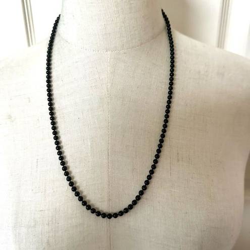 Daisy Oops a  black beaded long necklace