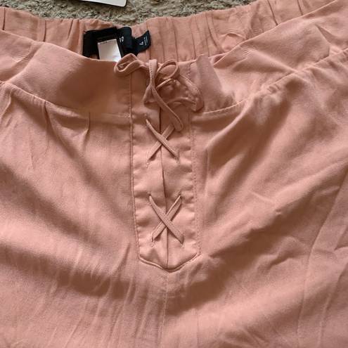 Torrid  | pink crepe lace front shorts