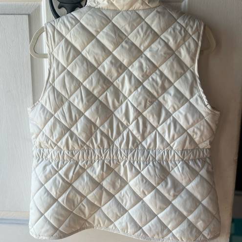 St. John’s Bay White puffer vest with gold accents