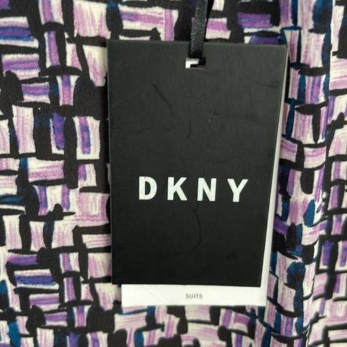 DKNY  geometric blouse. NWT. Size Medium.  Unique scalloped and gathered sleeves.