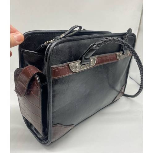 Bueno  Handbag black with lots of pockets all over the handbag. Braided shoulder