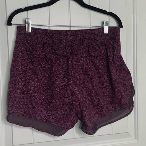 Athleta  printed mesh racer run shorts 4 inch inseams size medium running