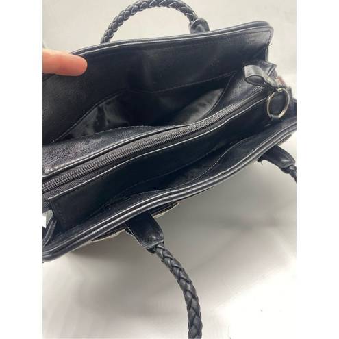 Bueno  Handbag black with lots of pockets all over the handbag. Braided shoulder